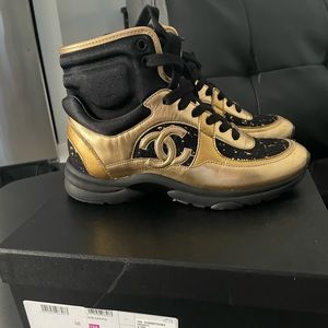 Sold out black & gold high top Chanel sneakers